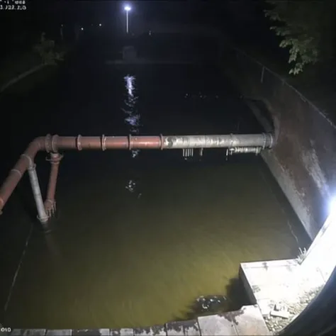 <lora:webcams:1>,  webcamscrenshot, 

Sewer System: The camera shows the underground sewer system, with murky water and rusted pipes. The only light comes from the occasional flickering bulb, and strange movements and sounds can be seen and heard in the darkness.