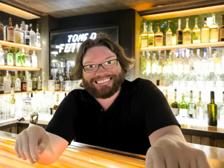 Cannon EOS 5D Mark III, photo of a bartender behind the bar, depth of field, (handsome), glasses, long hair, detailed face, dark theme, Night, holding his hands out welcoming, friendly, man, interior of a dimly lit bar club with neon lights with focus on the bar, alcohol bottles stocked