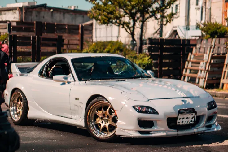 (masterpiece,best quality:1),official art,extremely detailed CG unity 8k wallpaper,illustration, light,car, bright, motor vehicle, ground vehicle, sports car, vehicle focus, wet, outdoors, morning, summer, sunny,shine,moving,speed, tokyo, shinjuku \(tokyo\),shibuya \(tokyo\),skyscraper,traffic,road sign,1990s \(style\),wide shot, wide angle, <lora:ligneClaireStyleCogecha_v10:1.2> <lora:FD3S-000008:1>