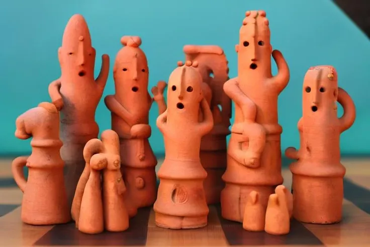 UECO, haniwa, statue, haniwa <lora:idol_v1:0.8>,  on a chess board, chess pieces, knight, king, queen, rook, pawns, bishop