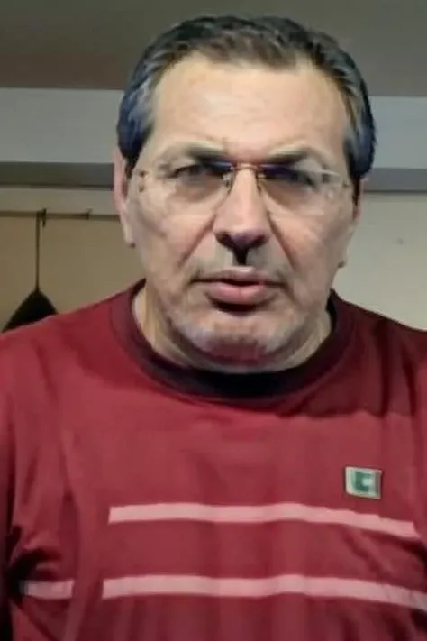 a realistic photo of Stefanos Xios with red jacked <lora:StefanosXiosV3:0.85>