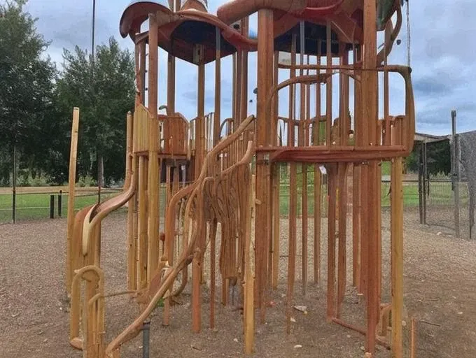 strange and creepy (wooden (character)) on the kids playground, ((weirdcore))