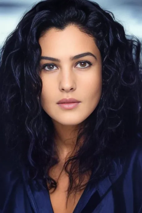 close up portrait of a woman. mbell00,<lora:Monica Bellucci:1> black long hair, wearing a fur coat, looking at camera , high detailed face, blue eyes, majestic hair, (high detailed skin:1.2), behind the glacier mountains, snow 8k uhd, dslr, soft lighting, high quality, film grain, Fujifilm XT3