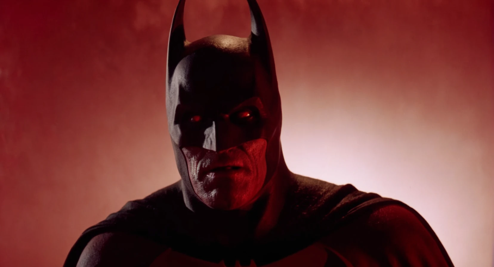 cinematic film still of Cinematic Film stock footage in (arri alexa style) Kodak film print, <lora:Batman Vampire:1> Batman Vampire a batman villain with a red background and vampire fangs <lora:Vampire-000003:1>, shallow depth of field, vignette, highly detailed, high budget, bokeh, cinemascope, moody, epic, gorgeous, film grain, grainy