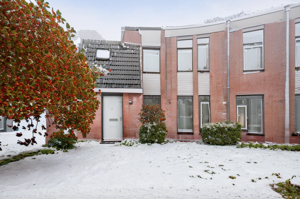 single path to the front door of a square red brick house with a shrubbery at each side, windows with blinds, winter snow, sunset  <lora:GriendenStyleMerged_04:1>