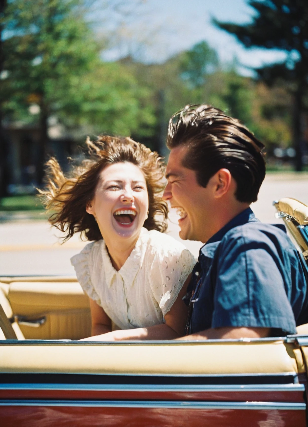 A candid snapshot of a couple in a vintage convertible,captured on film with genuine spontaneity. The wind tousles the woman's hair as they share a genuine laugh,and the colors rendered by the film create a warm,sun-soaked nostalgia for carefree moments.,