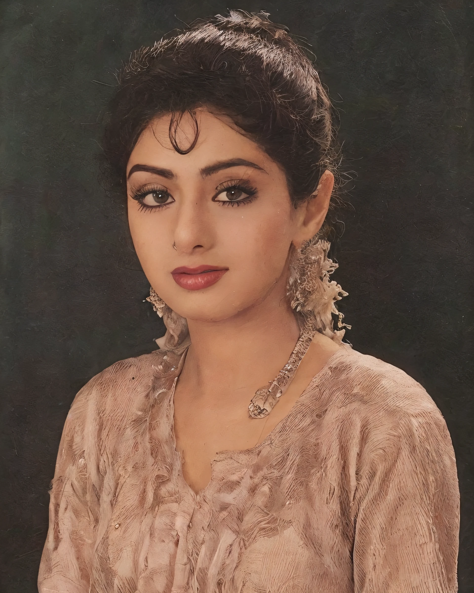 photo of a sridevi woman in a dynamic pose wearing elegant high-neck Patiala Suit looking at camera with Contented sigh with closed eyes expression, film grain, perfect eyes, at a changing room beautiful bokeh <lora:Sridevi_SD15_LoRA_prodigy_local_regs-000002:1>