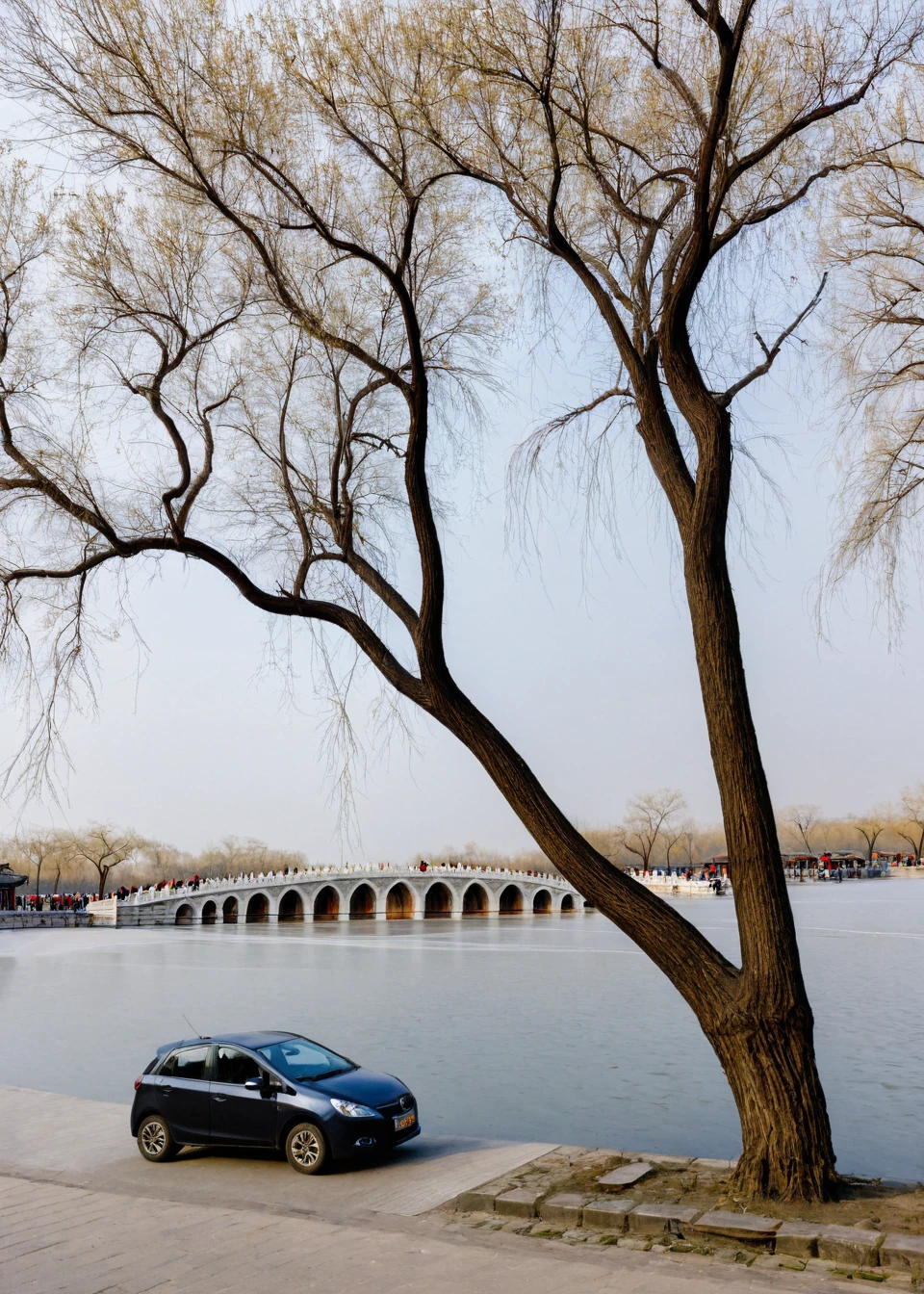 <lora:é¢åå:1>,The Summer Palace, tree, scenery, bridge, outdoors, bare tree, multiple boys, car, ground vehicle, sky, motor vehicle, water, building, river, day, road, street, city, dutch angle, real world location, power lines, 6+boys, cloud, masterpiece, best quality,