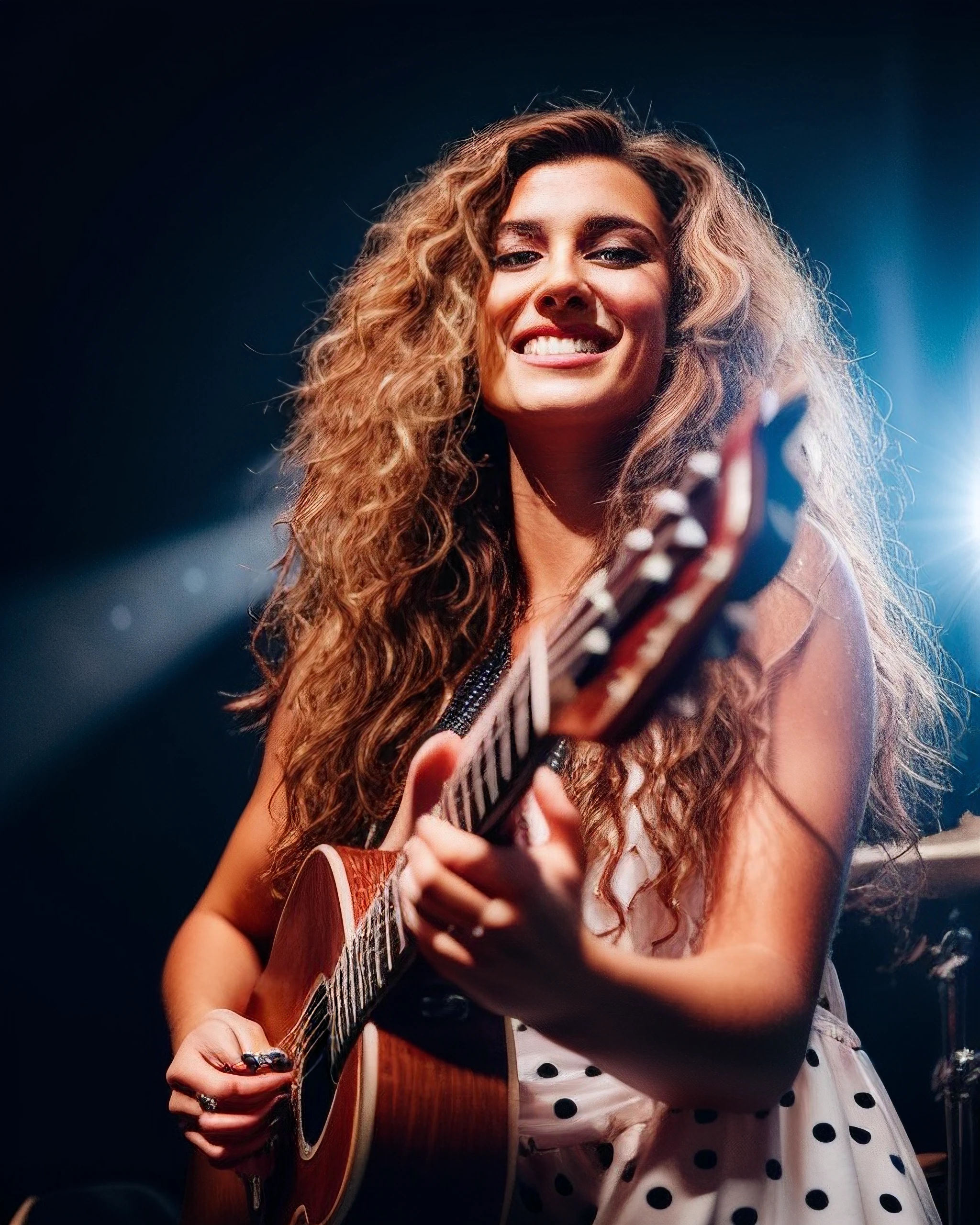 tori-k, close-up, (realistic), (hyperrealism), long hair, blonde highlights, happy, playful, (photorealistic:1.4), best quality, masterpiece, messy hair, curly hair, frizzy hair, on stage, backlight, glowing hair, holding guitar,  1girl, makeup, detailed eyes, polka dot dress
