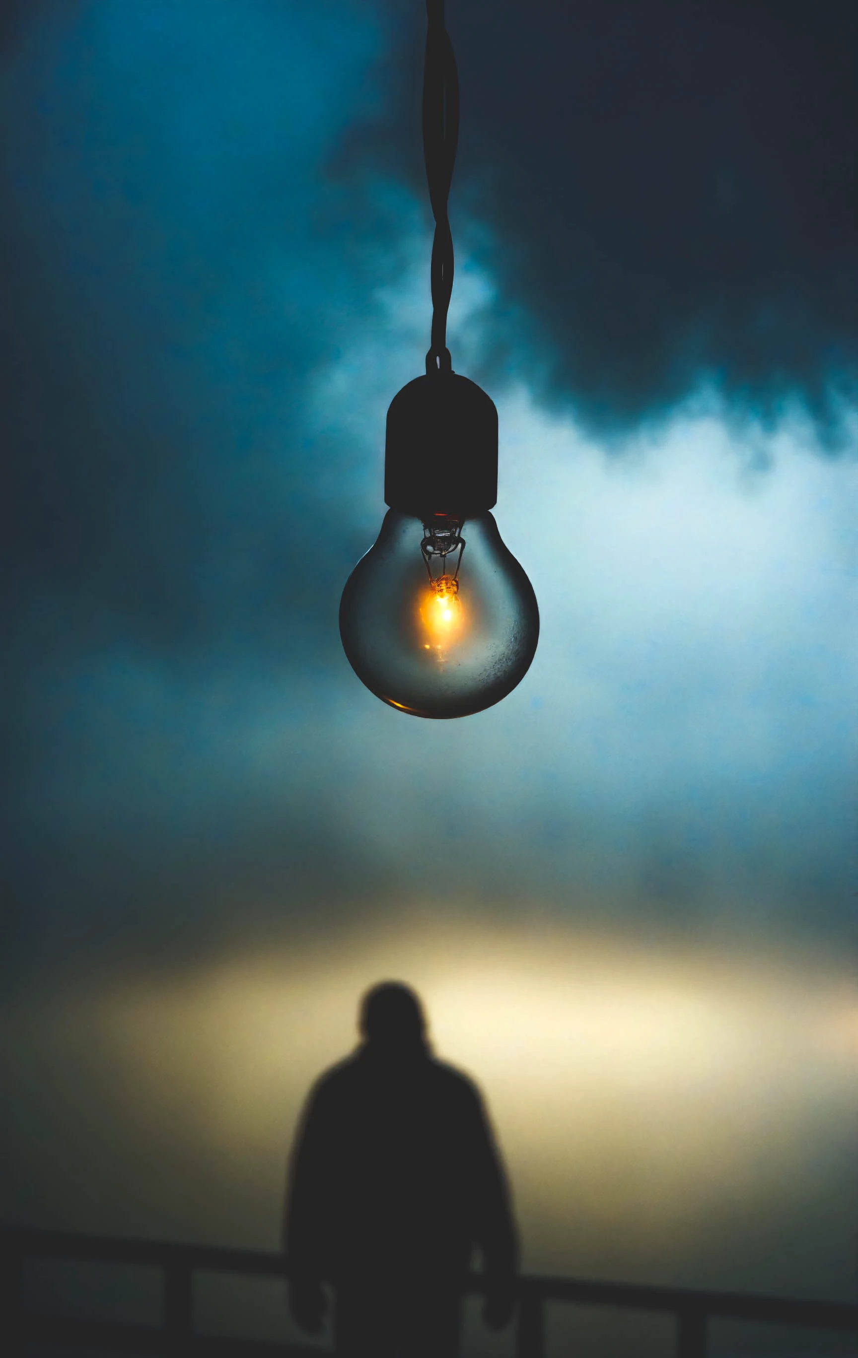 cinematic shadow, silhouette, standing, fog, gray skies, cinematic lighting, (light bulb, hanging, light particles:1.2), horizon, water drop, epic, depth of field, film grain, <lora:SDXLHighDetail_v5:0.3>