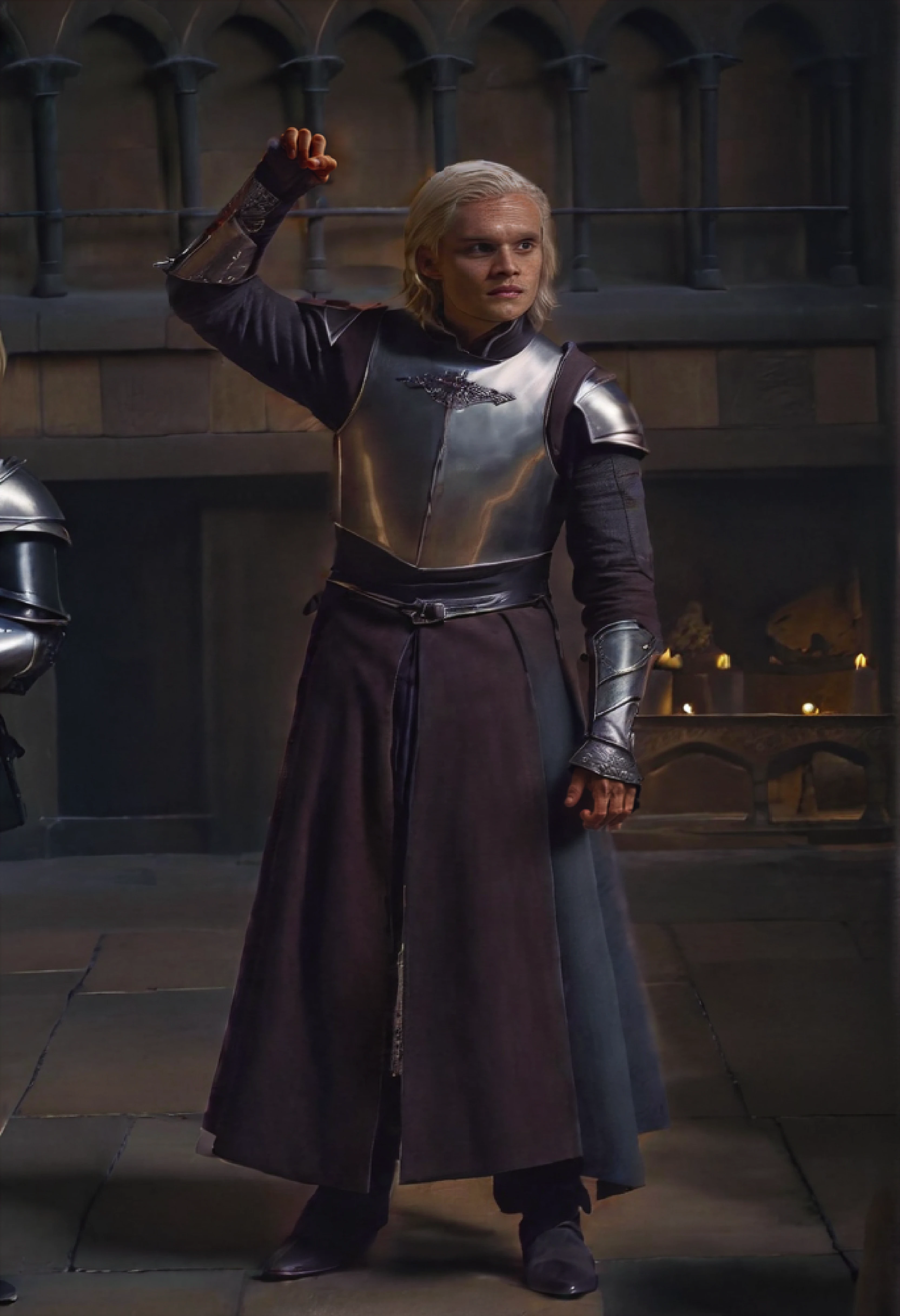 <ckpt:ZavyChroma.safetensors>, <ckpt:Fluently.safetensors>,<lora:TomGlynnCarney.safetensors:1.2>, Photograph of Tom Glynn-Carney, TGC, Aegon II Targaryen, blonde hair, grey eyes, chin length hair, Targaryen royal armor, hand up in triumph, royal courtyard, game of thrones, Raw photo, Canon EOS R3