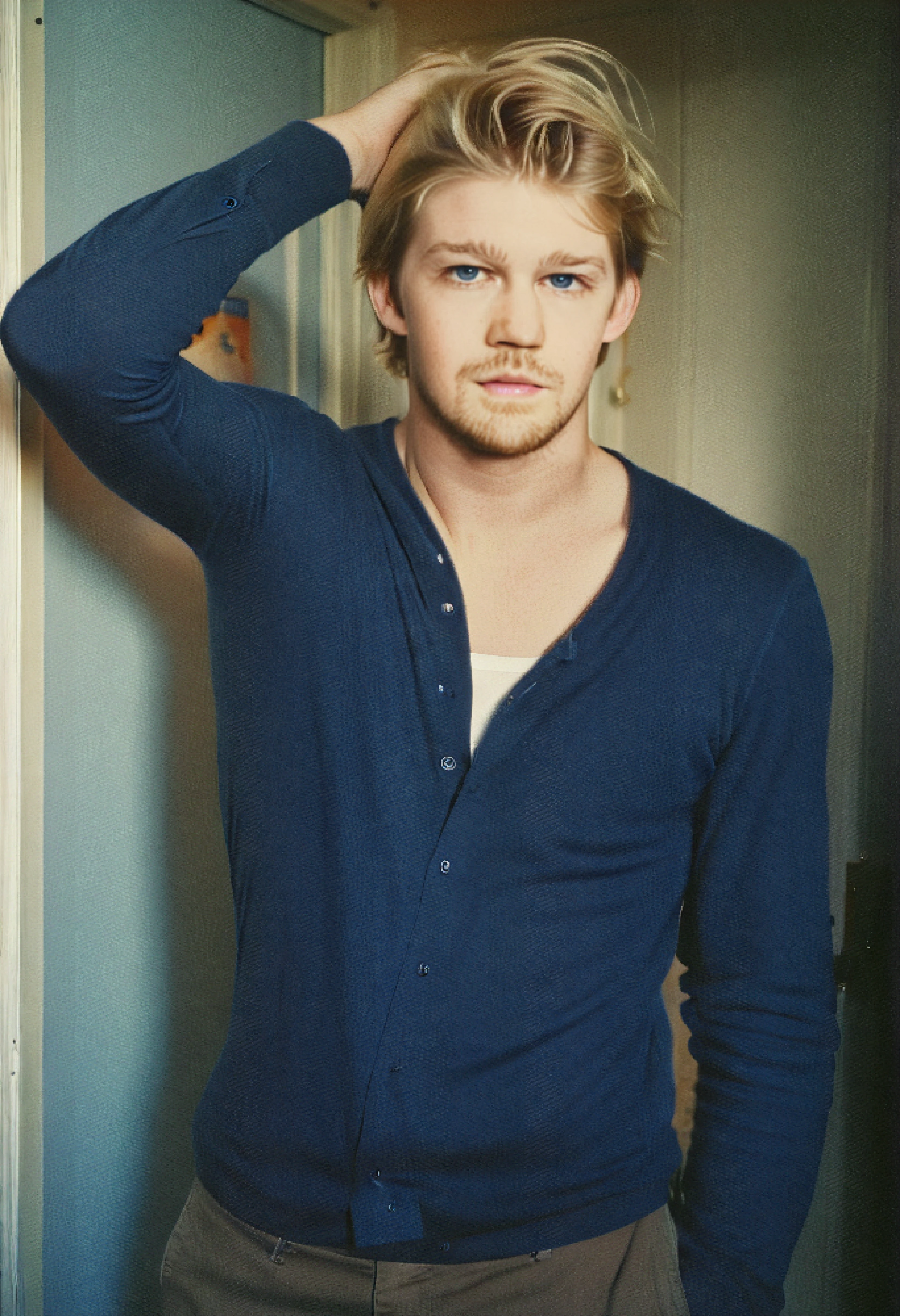 <ckpt:ZavyChroma.safetensors>, <ckpt:Fluently.safetensors>, <lora:JoeAlwyn.safetensors:1.2>, Photograph of Joe Alwyn, J034lwyn, blonde hair, blue eyes, standing against door, Raw photo, Canon EOS R3