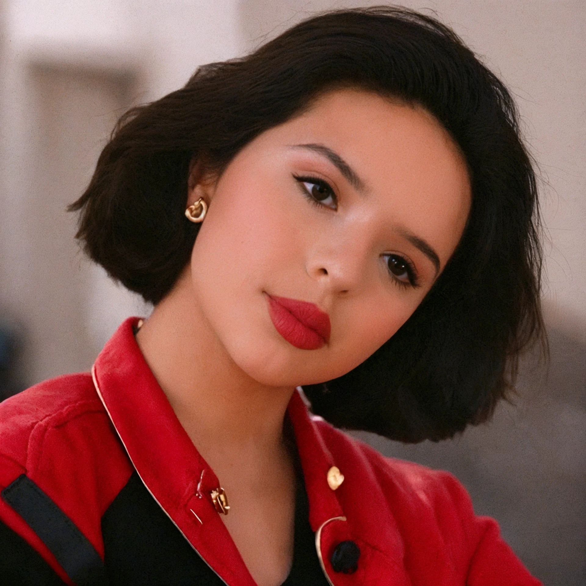 <lora:Angela_Aguilar:0.8>, Raw close-up portrait photo of Angela Aguilar wearing a black top with a red jacket, black bob hairstyle, sharp focus on subject, neutral expression, Shot center frame with a Nikon F3 and a 35mm f/2 lens, using Kodak Portra 400 film stock by Lilia Alvarado