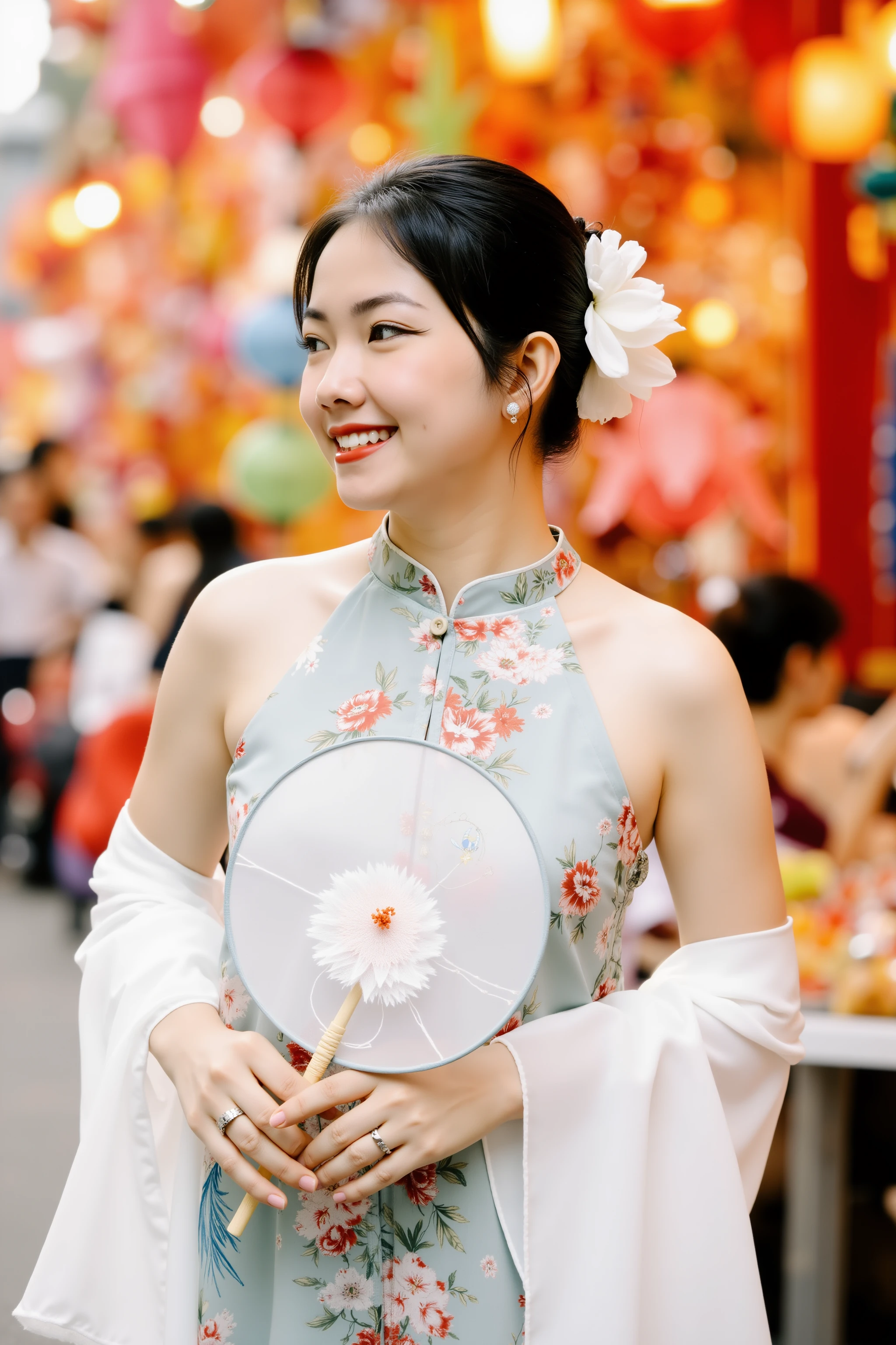 HanoiGirl, MidAutumn, A young woman is standing in a vibrant street setting, surrounded by colorful decorations and lanterns. She is dressed in a floral sleeveless dress with a traditional Asian aesthetic, complemented by a flowing white shawl draped over her arms. Her hair is styled in a neat updo, adorned with a large white flower. She holds a delicate round fan with a floral design, adding to the elegance of her appearance. The background is lively, filled with a multitude of bright colors and festive ornaments, suggesting a celebratory or cultural event. The woman’s side profile and serene smile convey a sense of grace and happiness.
