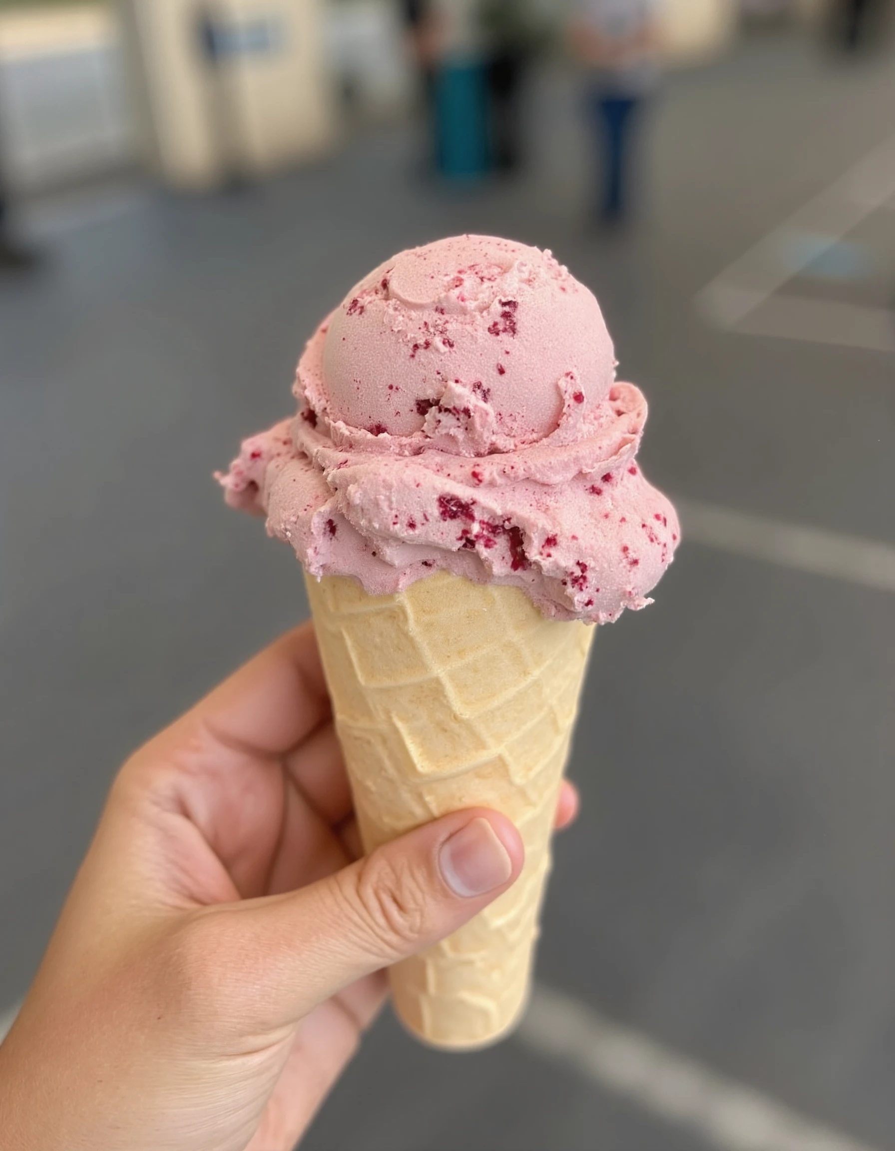 Photo of a hand holding a delicious ice cream cone.<lora:Aesthetic_Amateur_Photo_V4:1.0>