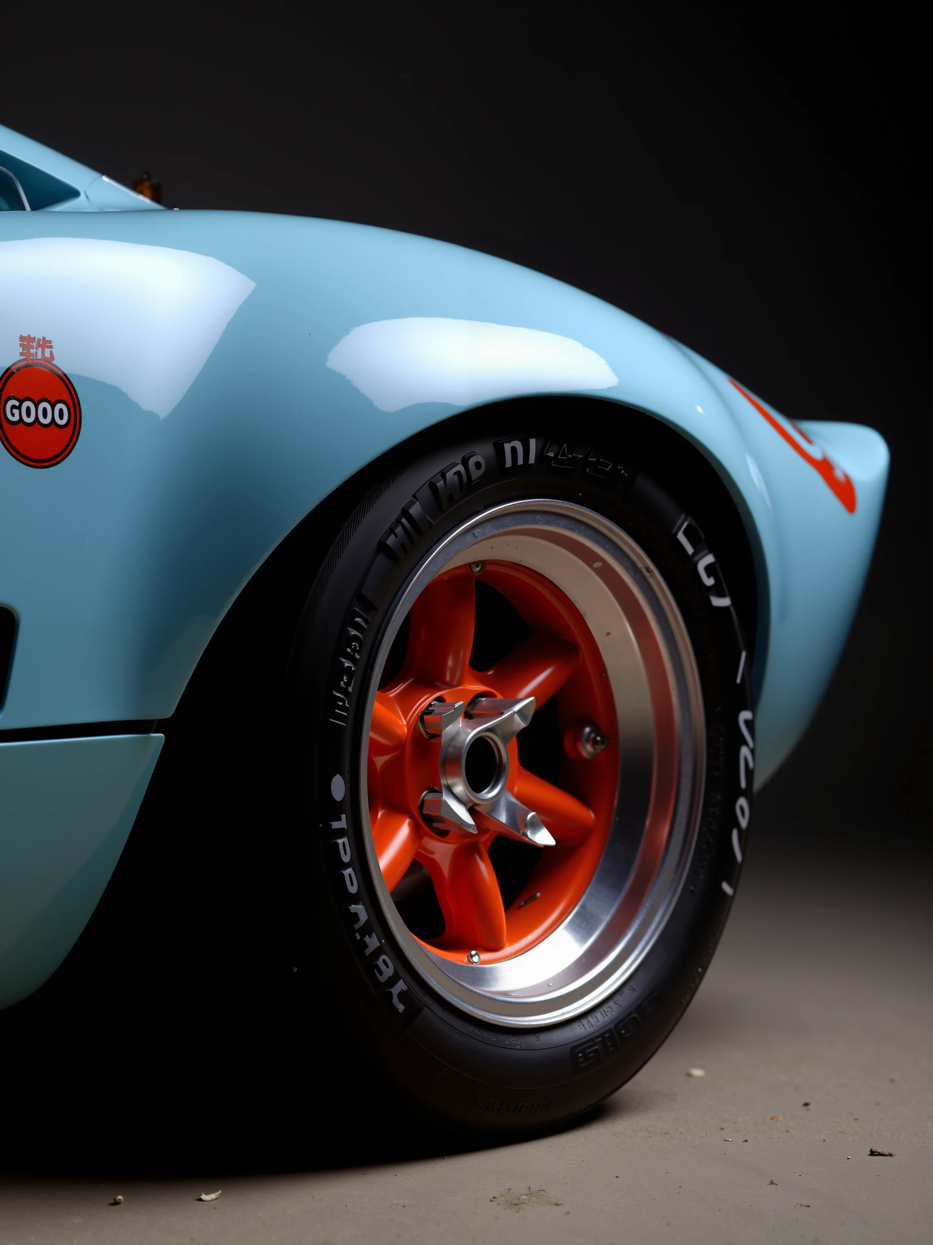 close up,rim, wheel, tire, chrome orange wheel GT40, parked, side, in a dark studio setting , baby blue car,