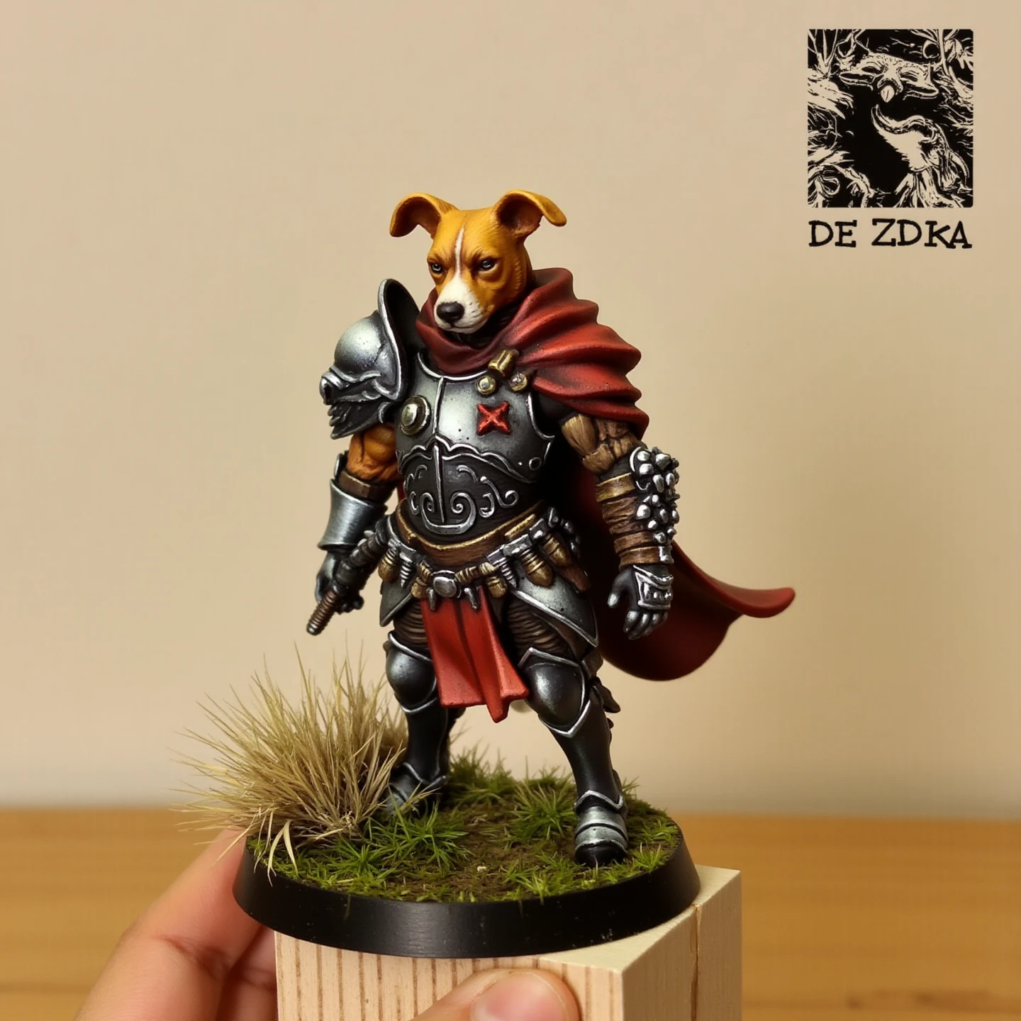 RAW Photo of a handpainted miniature of a dog, wearing a fantasy metal armor and a red cape, C00k13, yellow fur, on a grass round base on top of a wooden table. Front View, Promotional Picture.