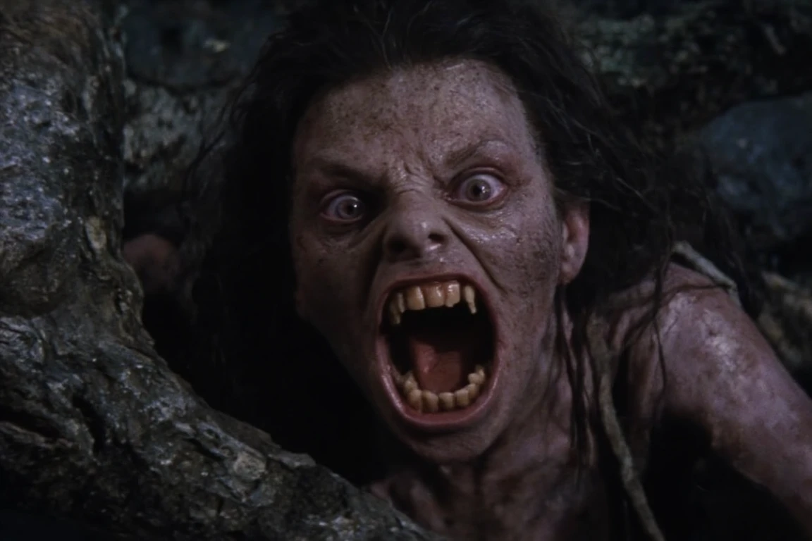 cinematic film still of <lora:Fright Night 1985 style v2:1>
High Angle from above, In the 1980's Cinematic high angle from above,a medium Closeup Shot,Film Footage captured by Panavision Cameras and Lenses,vampire human,Amy a sweaty vampire woman with a scary vampire face and a white nude scarf dress,staring at camera,with messy red brown hair,and perfect vampire fangs teeth,and dark black lenses,with open grin,screaming in front of camera with a vampire mouth in a dark room,Fright Night 1985 Film Style,solo,looking at viewer,open mouth,1boy,male focus,teeth,fangs,portrait,realistic , horror themed, dark themed, low key light, dramatic light, dramatic shadow light, contrast, cinematic color, cinematic look, filmic, realistic, realism, perfection, perfect, Kodak, Kodak film, movie still, Fright Night 1985 style, Fright Night Film style, shallow depth of field, vignette, highly detailed, high budget, bokeh, cinemascope, moody, epic, gorgeous, film grain, grainy