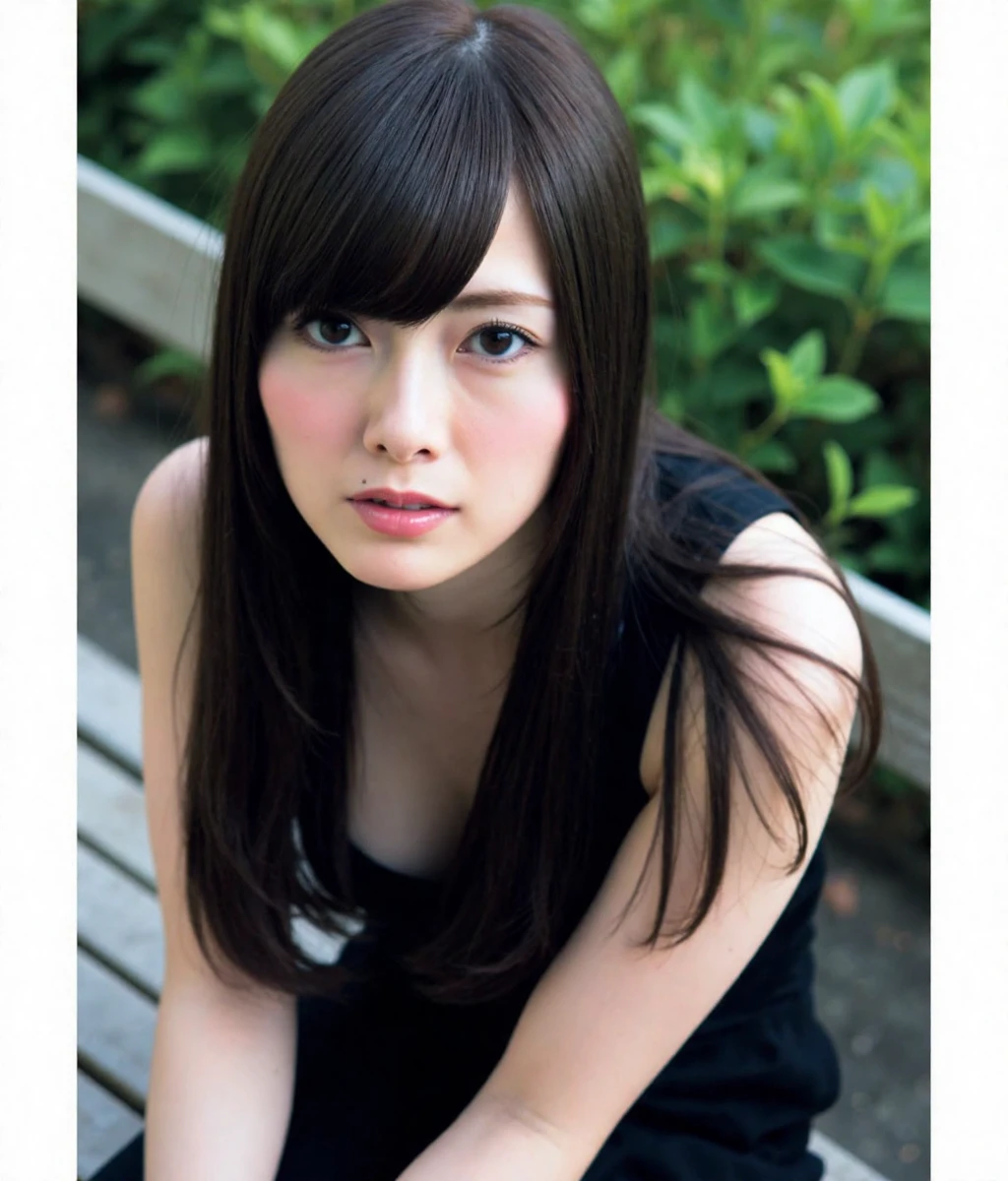 shiraishi, The image is a portrait of a young woman sitting on a bench. She has long dark hair with bangs and is wearing a black sleeveless top. Her is looking directly at the camera with a serious expression. The background is blurred, but it appears to be an outdoor setting with greenery. The overall mood of the image is somber and contemplative.