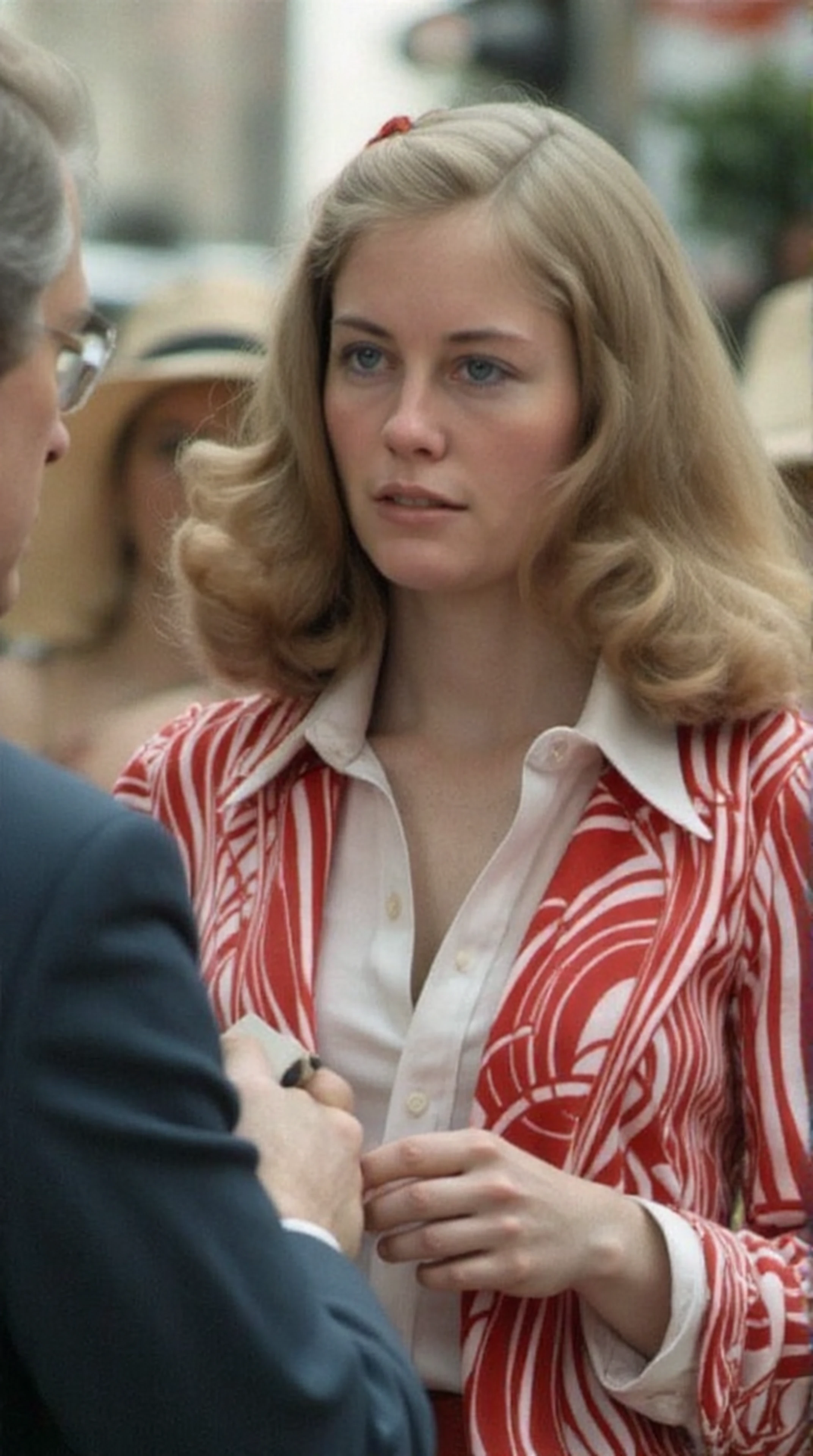 woman, upper body, she's taking notes on a small notepad, a man in front of her is speaking to a crowd, it is about 1976 in NYC and the man is running for congress