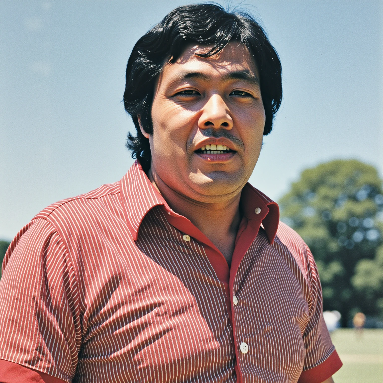 photo of Jumbo Tsuruta in a pattern polyester polo shirt, circa 1973