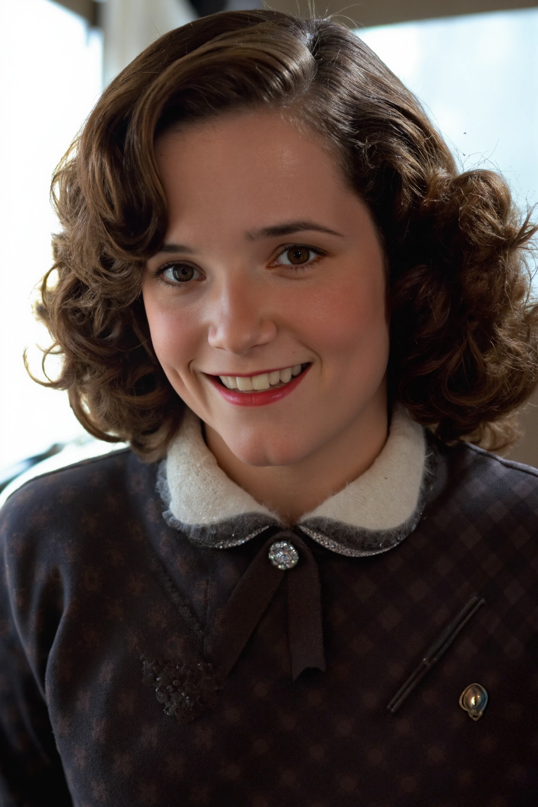 The image features a casual setting, with a girl with a fair complexion, curly brown hair, who is smiling warmly at the camera. She is dressed in a 1940s or 1950s style outfit, high-necked dress with intricate lace details on the front and a ornamental brooch.