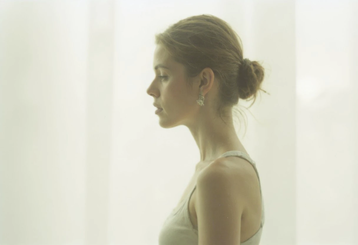 an aesthetic, minimalist depiction of a female profile in side view. The focus is on the soft contours and calm, monochromatic tones. The scene feels mystical and dreamy, almost as if viewed through a delicate mist, with gentle light accentuating the silhouette. The background is diffuse and creamy white, drawing attention to the elegant simplicity of the figure.