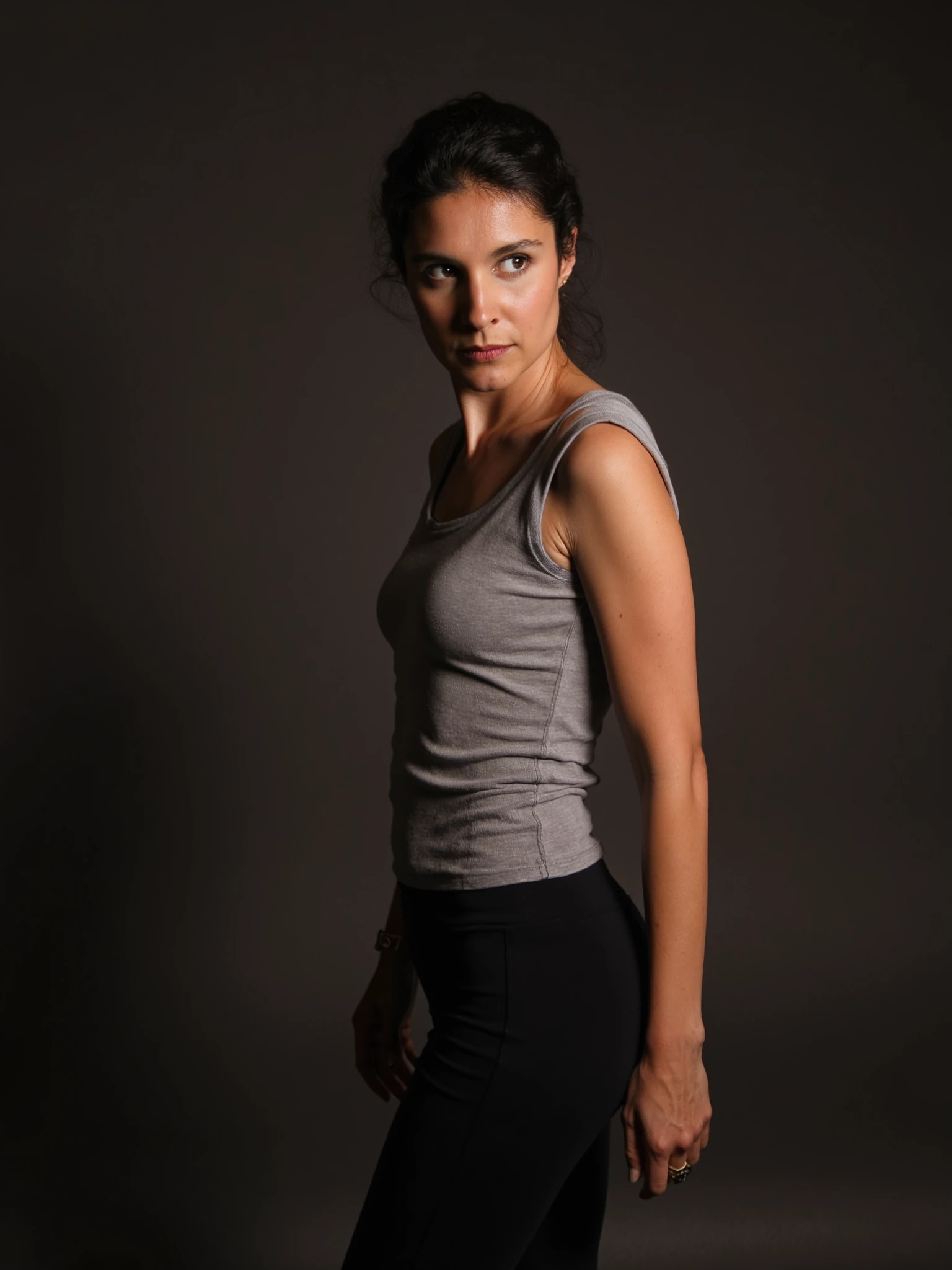 <lora:Apolline-de-Malherbe_Flux1D_LOREVER:1.2>
This is a photograph featuring ApoDeMal, a woman with light olive skin. She wears a sleeveless T-shirt with a black leggings. In perfect exposure with perfect contrasts with intricate light work.