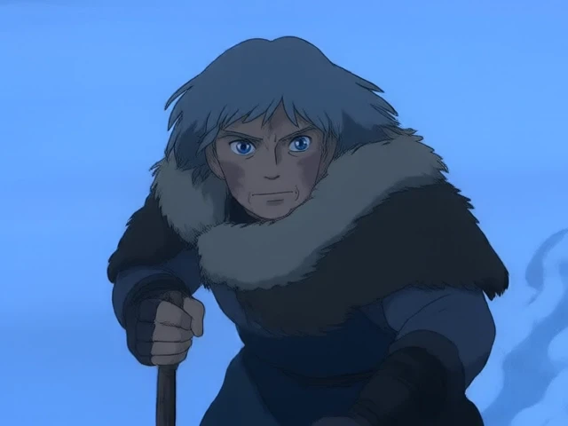 A scene from a Studio Ghibli animated film, featuring a high mountain pass blanketed in snow, with icy winds howling through the peaks. A weary traveler with gray hair, piercing blue eyes, and a heavy fur cloak is trudging through the snow with a staff. The camera sweeps across the mountains, emphasizing the vast, desolate landscape.