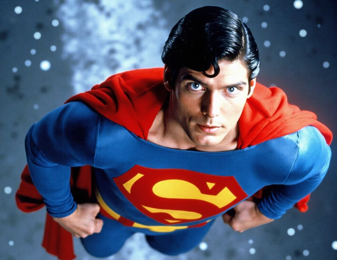 Superman flying through the air against a space background. He is wearing the iconic red and blue suit with the yellow and red "S" logo on the chest, and a red cape billowing behind him. His face is determined and focused, as if he is ready to take on any challenge.