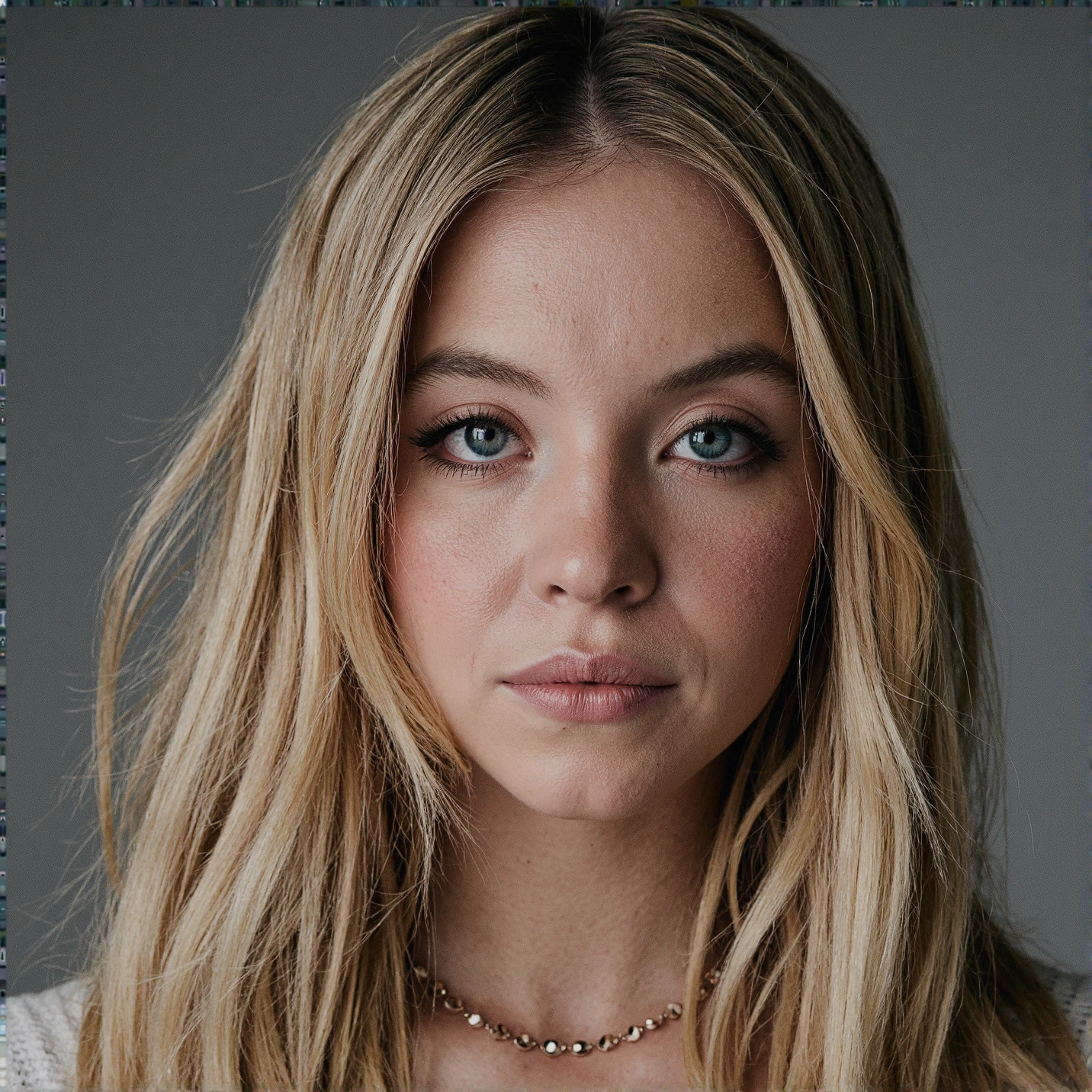 Breathtaking over the shoulder shot photography of ohwx looking at viewer, imperfections, necklace, looking over shoulders, eyelashes, fine hair detail, entire hairstyle visible, perfect eyes with iris pattern, sensual lips, nose, (perfectly sharp:1.3), realistic textures, (deep focus, focus on background:1.5), 8k uhd, dslr, ultra high quality image, film grain, Fujifilm XT3