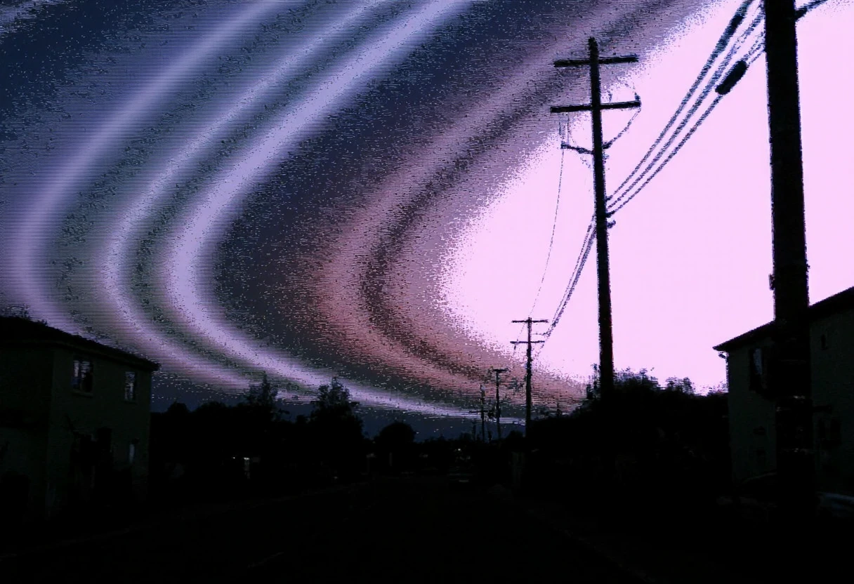Circuit-bent/glitch art photograph showing a street scene with power lines and poles, evening lighting, two buildings on either side, no people present, urban setting, straight-on angle with emphasis on the lines, original colors are mostly blue and gray, vertical linear distortion effect, pastel pink and purple dominant color shifts, streaking glitch patterns, noticeable pixelation artifacts, high corruption level,