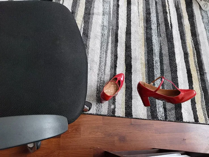A world where woman high heels and shoes start to walk by themselves, as if an invisible nude woman were wearing them