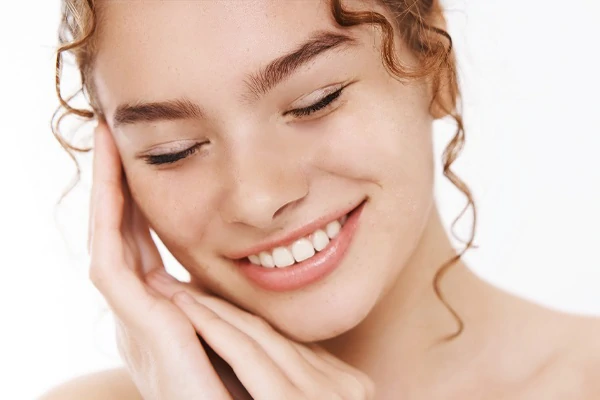 Before and after using AI blemish remover