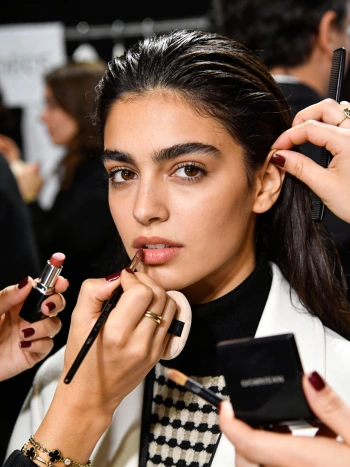 Runway backstage scene generated with Gemini AI prompts showing fashion show preparation atmosphere