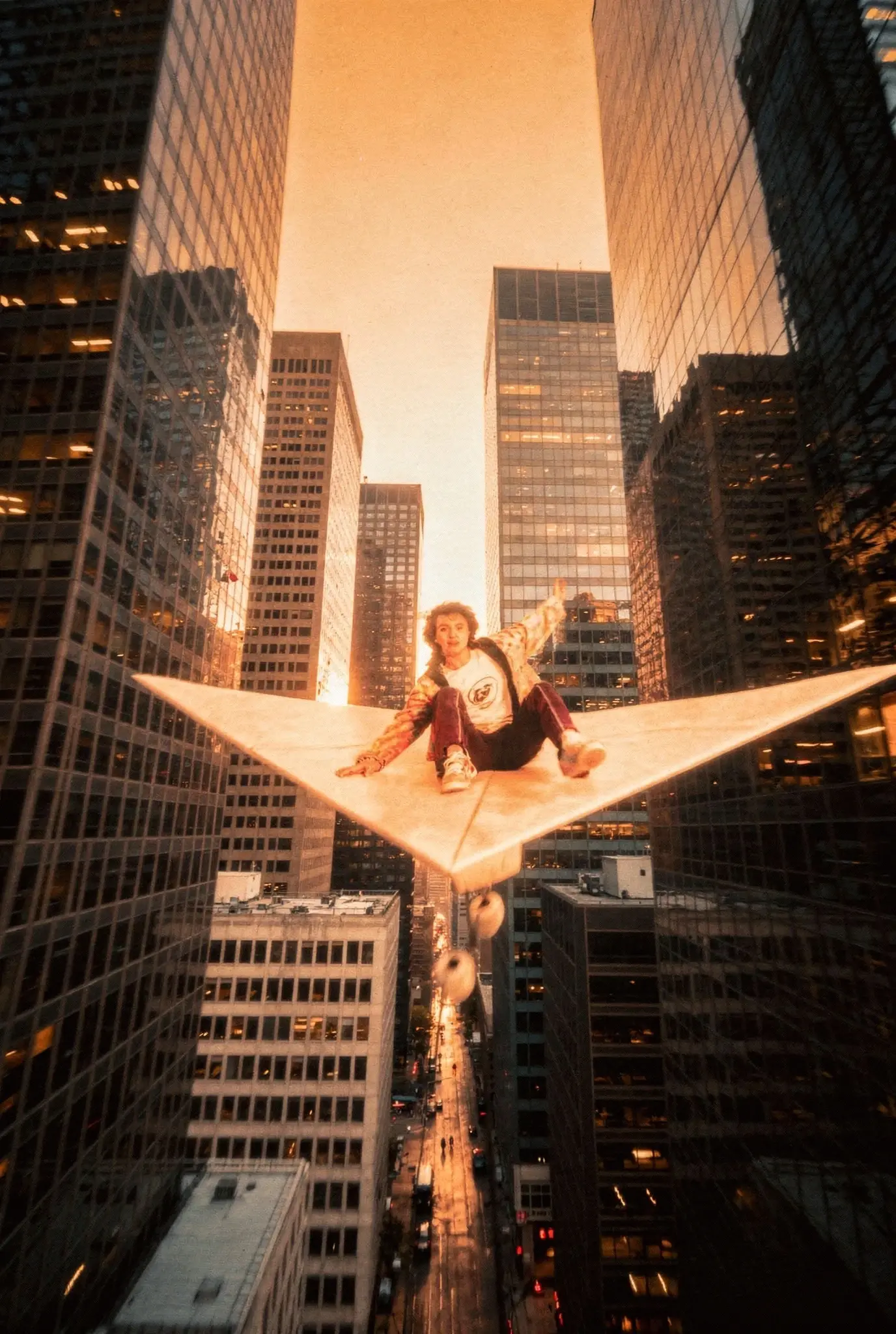 Worm's eye view of person on giant white star platform suspended mid-air between skyscrapers at golden hour