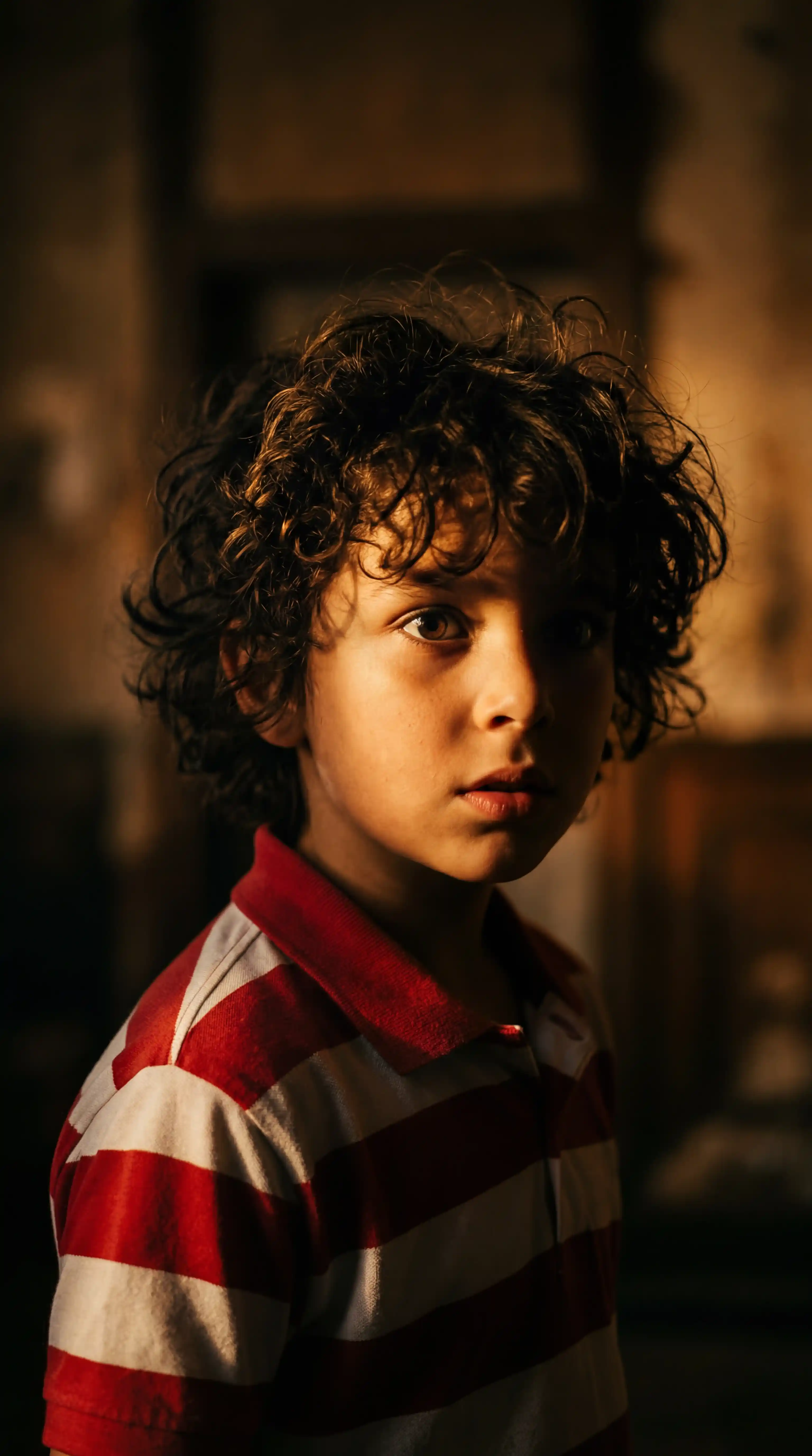 Grok AI Portrait Prompt โ Young Boy With Curly Hair in Dramatic Chiaroscuro Side Lighting