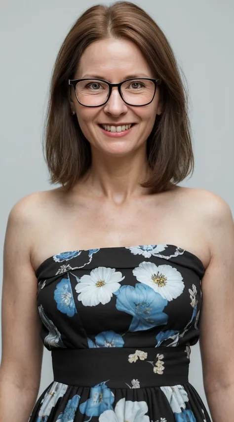 arafed woman with glasses smiling and looking at the camera, short neck length brown hair, wearing a black and blue floral sun d...