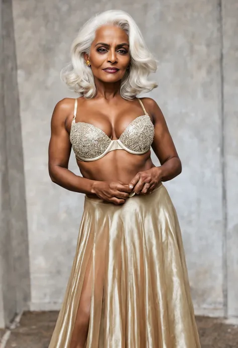 pavna, a 50-year-old indian ifbb, dark skinned, white hair, thick lips, iridescent sheer skirt, shiny gold bra 