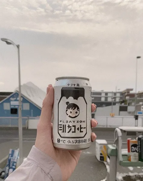 Someone holding a can of soda in the parking lot, holding a can of beer, commend, commend girl, soy milk, commend aesthetic, commend feel, holding beer, commend girl aesthetic, Japanese travel aesthetic, beast, drinking a beer at train station, i suit it, ...