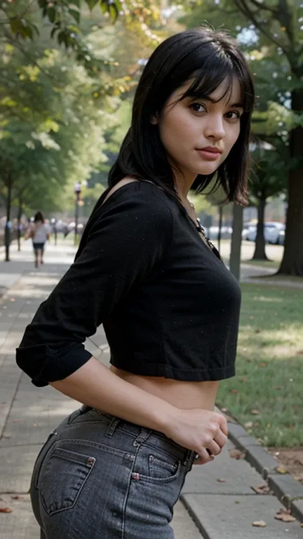 woman with black hair and bangs posing in a park, blurred background