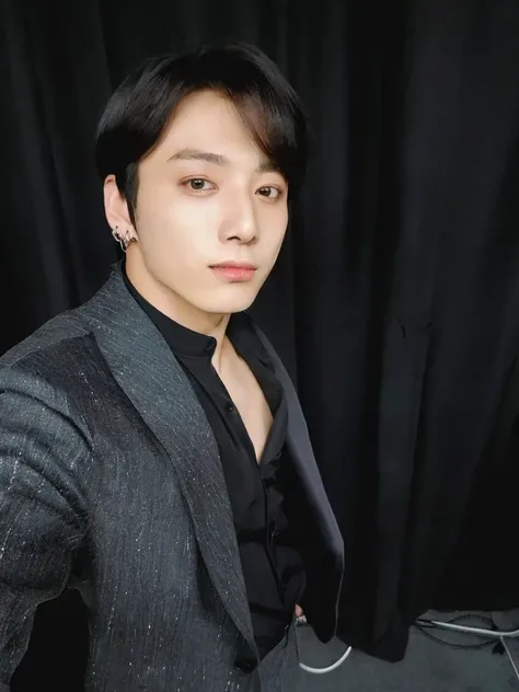 there is a man in a suit posing for a photo, Jungkook do bts, em um terno preto, hyung jungkook, jungkook 27bajos, vestindo terno preto, he is wearing a suit, Jungkook de cabelo preto, suave em fundo, handsome androgynous prince, Jungkook, Plump lips