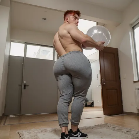 Redhead man, shirtless, wearing tight grey sweatpants with a comically massive and gigantic butt that is round, fat, full, and juicy. It’s like he has two blown up balloons in his pants