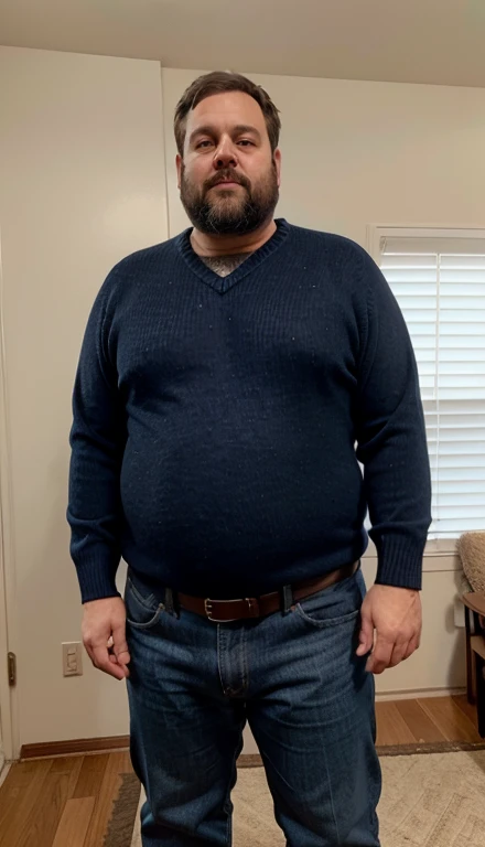 A large bellied overweight middle aged man in a navy sweater and jeans with belt, beard, receeding hairline,  large chest, dad, thick torso, rounded belly