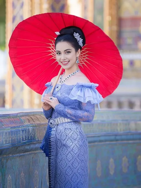 Araffe woman in blue dress holding a red umbrella, Sukhothai set, traditional beauty, According to Thawan Duchanee&#39;s style, In Lammanh style, Tailoring a suit according to tradition, traditional outfit, Wear elegant clothes, Niwan Chandra, traditional ...