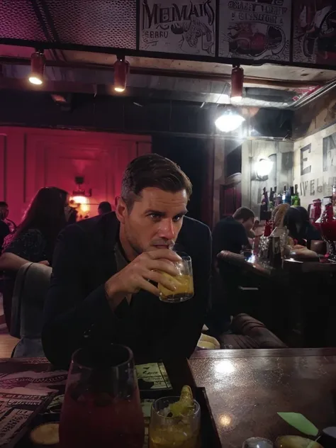 Handsome man drinking in a bar