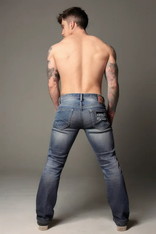 Jordan Brandt , 45yo, wearing gray jeans, shirtless, backside bent over 