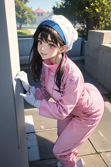 Wearing large pink rubber gloves, white rubber boots and a white cloth wrapped around her head、A dark-haired mature woman in a blue long-sleeved jumpsuit smiling kindly while cleaning a dirty public toilet in a park