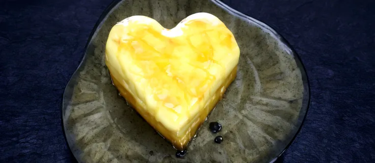 there is a heart shaped piece of cheese on a plate, butter, butter sculpture, made of cheese, heart, melted cheddar, Melting cheese, cheap, mustard, soap, fat, melted cheese, molecular gastronomy, melting, heat, made of glass , cheesy, lush, cream, potato,...