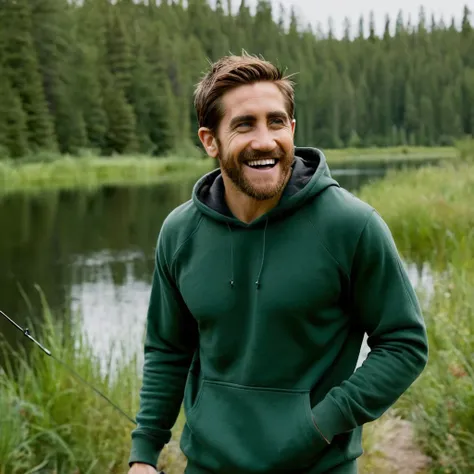 photo of jake gyllenhaal smiling man fishing hoodie and short, standing lake, fishing, outdoor trail, 35mm photograph, film, bokeh, professional, 4k, highly detailed, creek in the background, natural lighting